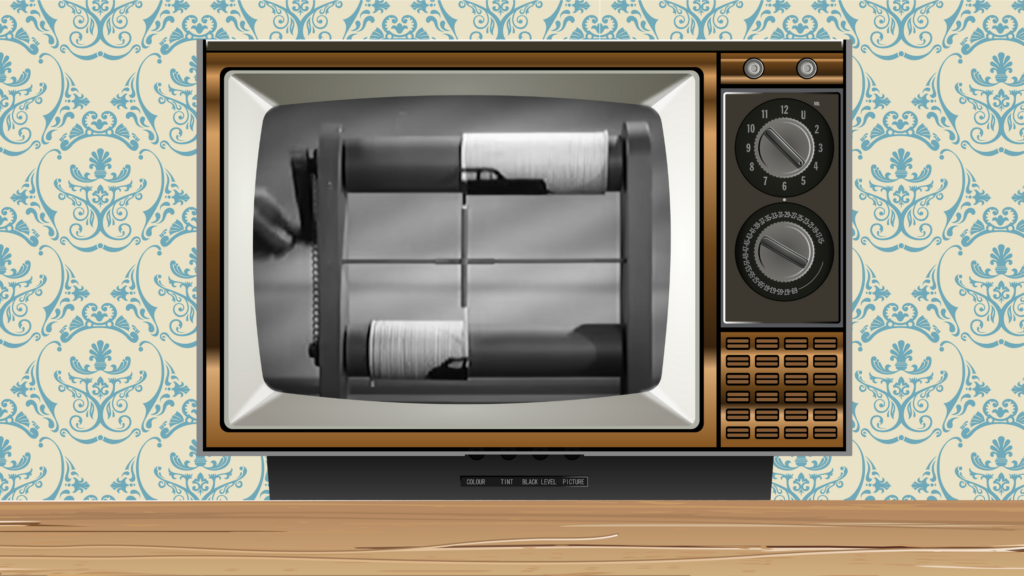 vintage television set playing a black and white movie